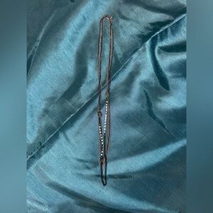 Set of (2) silver toned layered necklaces